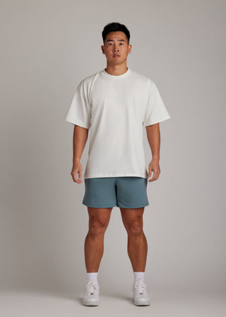 White oversized tee, soft breathable fabric, essential for comfortable everyday casual wear.