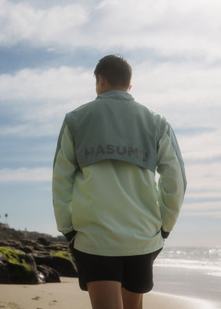 Taylor Day greens quarter zip windbreaker, lightweight and water-resistant.