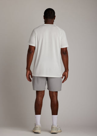 White 3-button polo shirt, breathable micro-mesh fabric, modern sport collar for golf.