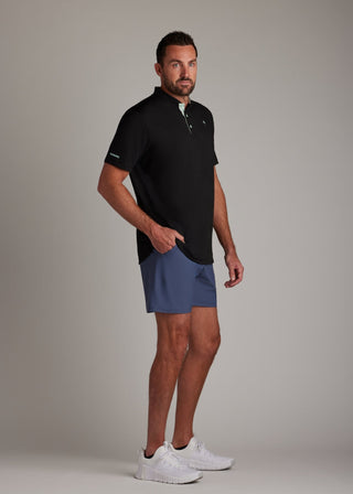 Black bladed collar polo shirt, sleek performance fabric, offering modern style and comfort.