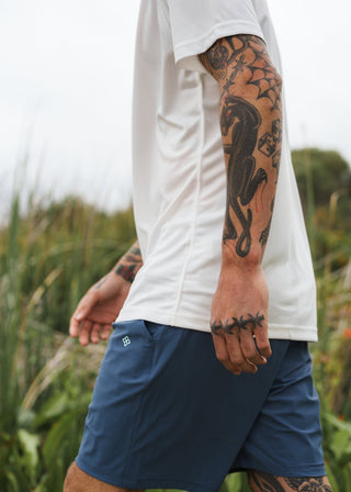 Indigo golf walk shorts made from ultra-lightweight, four-way stretch fabric.
