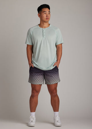 Black Fade active shorts made from versatile fabric, featuring zippered pockets.
