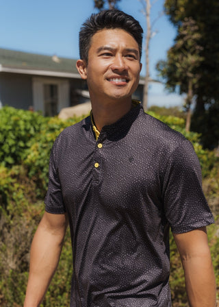 Snake skin pattern bladed collar polo shirt in performance fabric for modern athletic style.