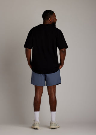 Black oversized tee made from soft, breathable fabric for everyday comfort.