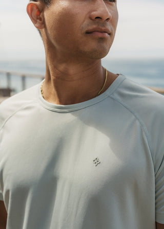 Seafoam green active tee made from ultra-light, breathable stretch fabric for athletic fit.