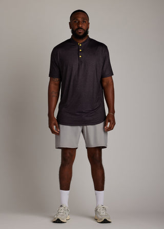 Snake skin pattern bladed collar polo shirt in performance fabric for modern athletic style.