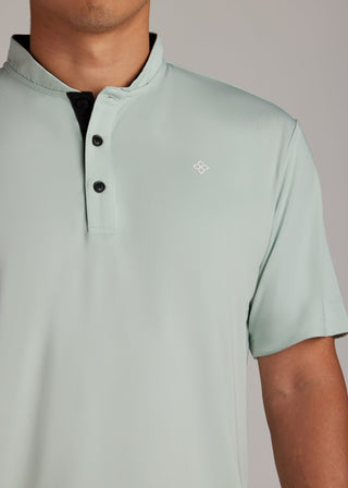 Green bladed collar polo shirt, sleek performance fabric for modern style.