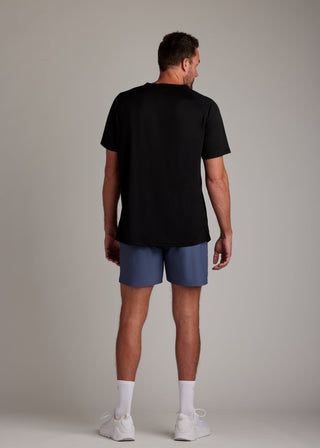 Black 3-button sport tee with modern collar, breathable micro-mesh fabric for active wear.