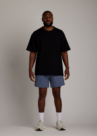 Black oversized tee made from soft, breathable fabric for everyday comfort.