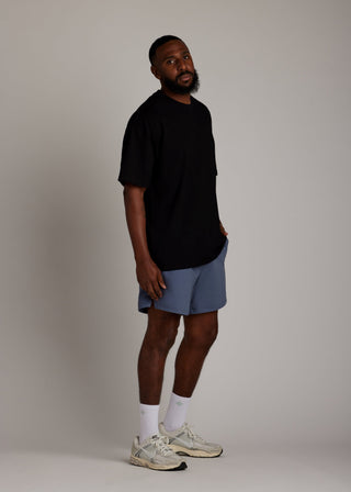 Black oversized tee made from soft, breathable fabric for everyday comfort.