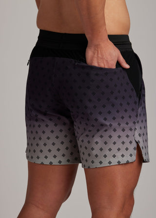 Black Fade active shorts with drawstring waistband and zippered pockets for training.