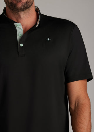 Black bladed collar polo shirt with sleek fabric, blending modern aesthetic and functionality.