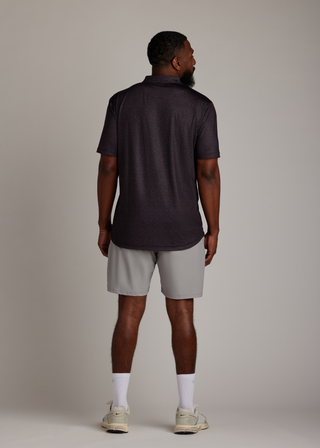 Snake skin pattern bladed collar polo shirt in performance fabric for modern athletic style.