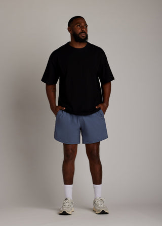 Black oversized tee made from soft, breathable fabric for everyday comfort.
