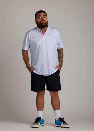 Cotton candy bladed polo shirt, designed with sleek performance fabric for golf.